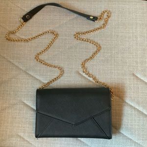 Black clutch with removable gold chain